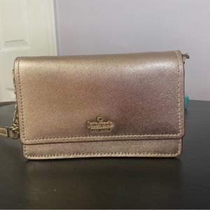 NWOT Kate Spade mini crossbody with chain link detail.